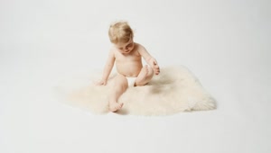 Stock Video Blonde Baby Sitting On A Rug Live Wallpaper For PC