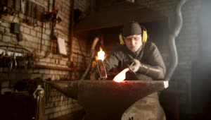 Stock Video Blacksmith Making A Knife With A Hammer On The Forge Live Wallpaper For PC