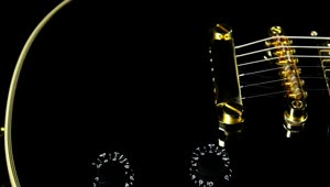 Stock Video Black Guitar With Golden Strings Live Wallpaper For PC