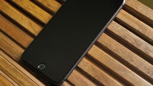Stock Video Black Cellphone On A Wooden Table Live Wallpaper For PC