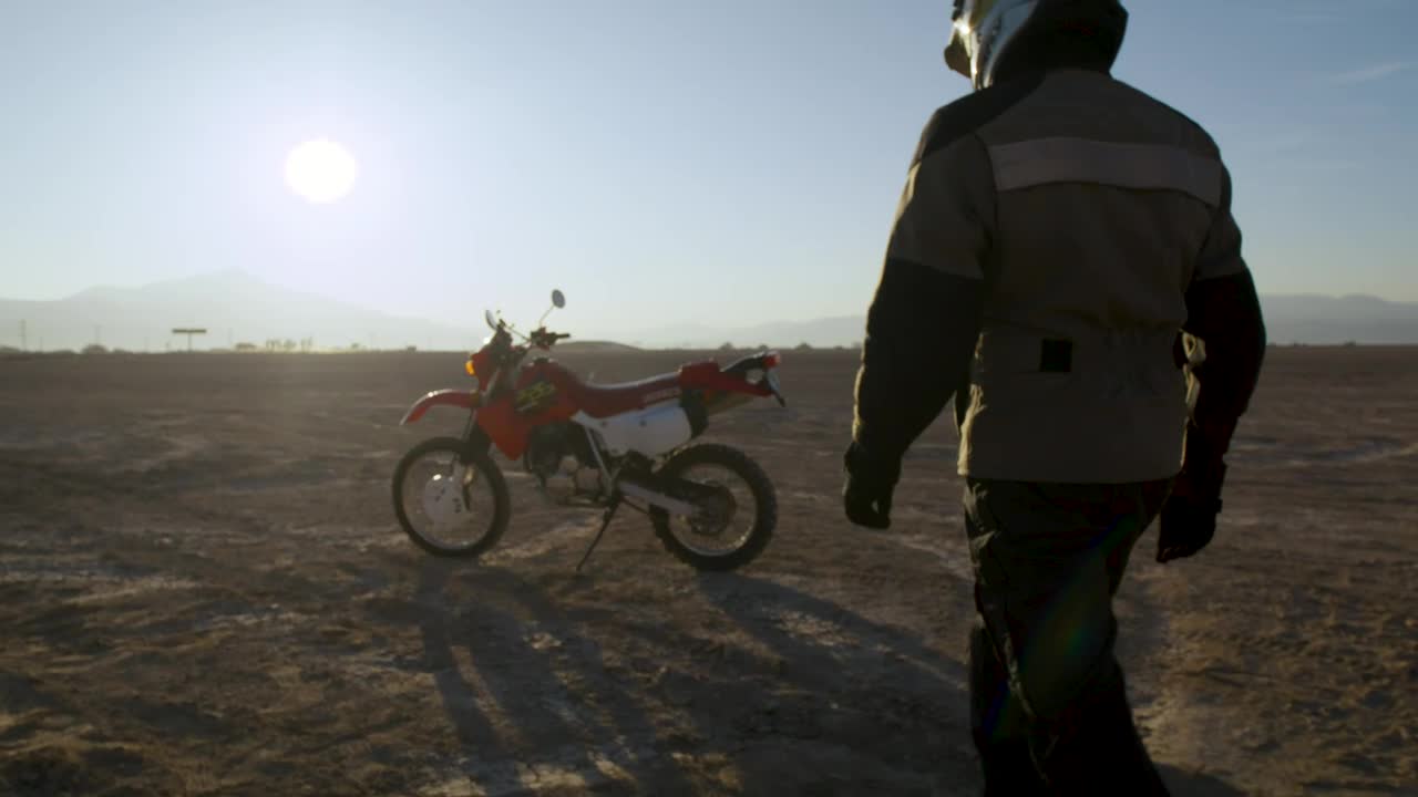 Download Stock Video Biker Walking Towards His Motorcycle Live Wallpaper For PC