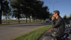 Stock Video Biker Resting Next To A Highway Live Wallpaper For PC