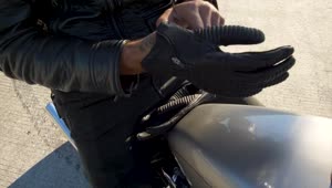 Stock Video Biker Putting On Riding Gloves Live Wallpaper For PC
