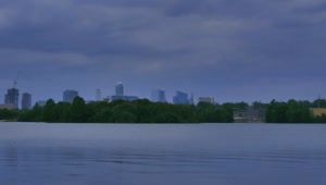 Stock Video Big Lake With Trees And A Big City In The Live Wallpaper For PC