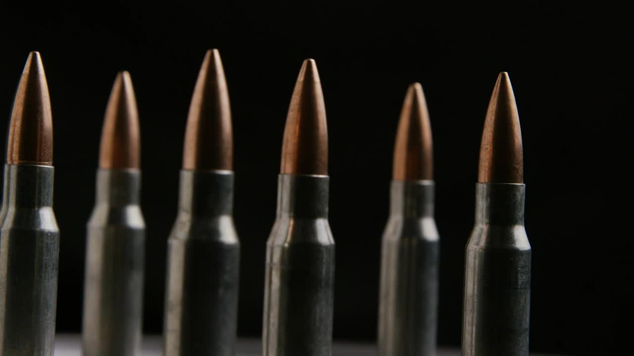 Download Stock Video Big Bullets Rotating On A Black Background Live Wallpaper For PC