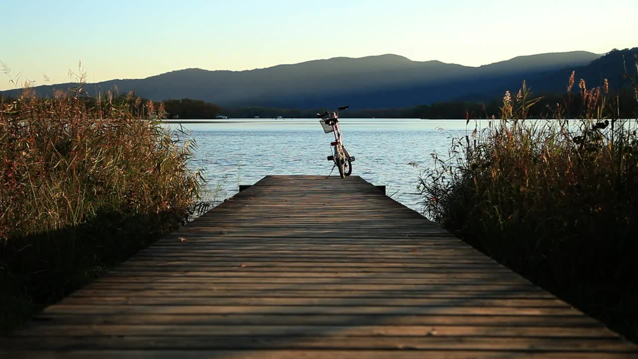 Download Stock Video Bicycle On A Pier Next To A River Live Wallpaper For PC