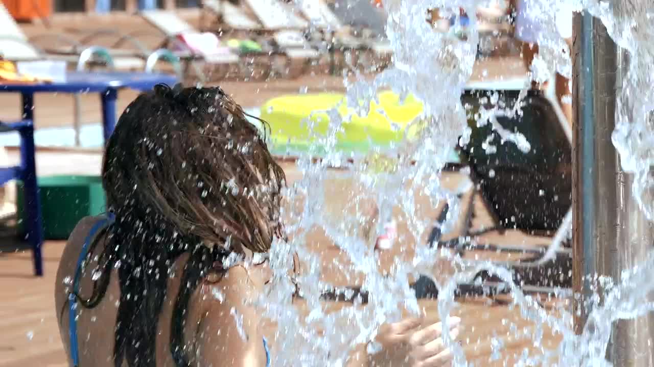 Download Stock Video Beautiful Girl In Bikini Splashed With Water At Resort Live Wallpaper For PC