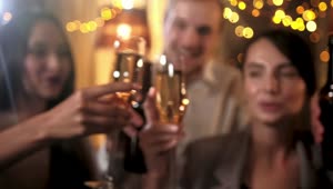Video Stock Closeup Of Friends Toast With Champagne And Holiday Lights Live Wallpaper For PC