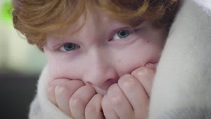 Video Stock Closeup Of Fearful Little Boy Wrapped In Blanket Live Wallpaper For PC