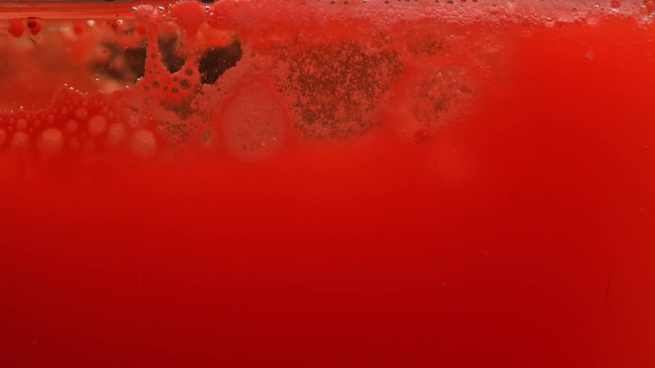 Download Video Stock Close Up View Of A Bubbling Red Liquid Live Wallpaper For PC