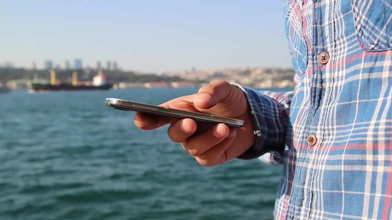 Download Video Stock Close Up To A Person Using His Smartphone Live Wallpaper For PC