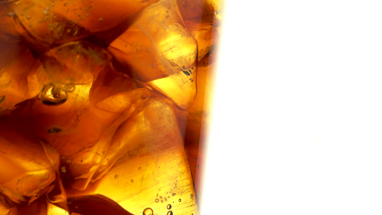 Download Video Stock Close Up Of A Glass Of Coke With Ice Live Wallpaper For PC