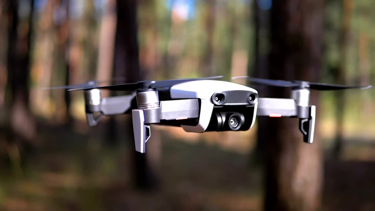 Download Video Stock Close Up Of A Drone Hovering In The Woods Live Wallpaper For PC