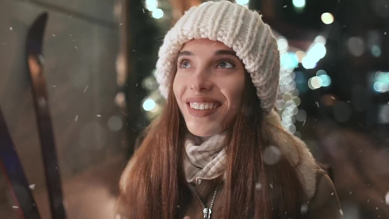 Download Video Stock Cinematic Of Woman Warming Hands In Nighttime Winter Town Live Wallpaper For PC