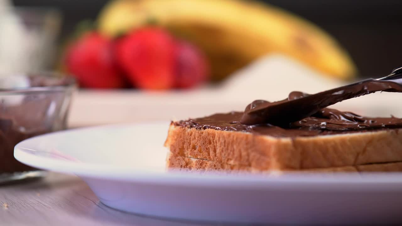 Download Video Stock Chocolate Or Hazelnut Cream On White Bread Live Wallpaper For PC