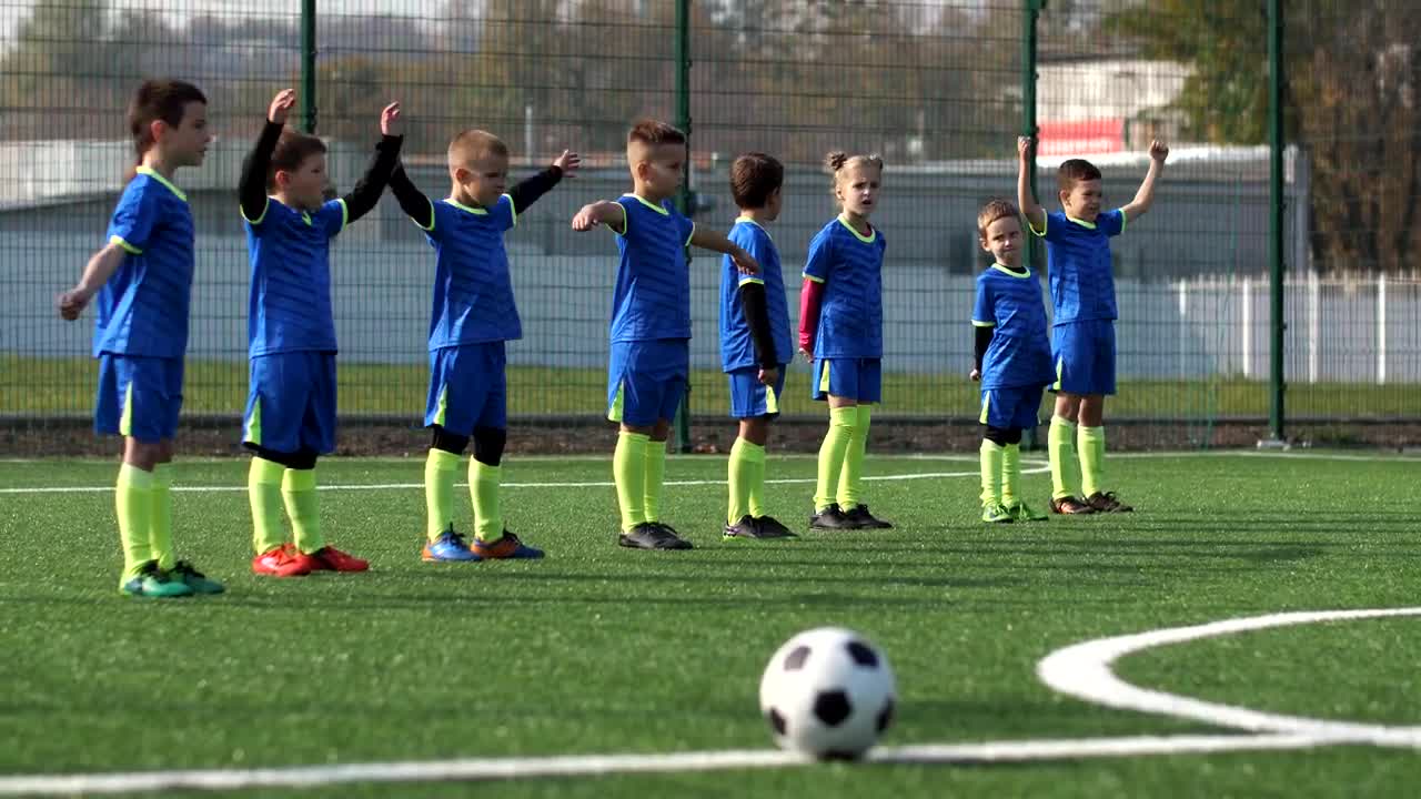 Download Video Stock Childrens Soccer Team Warming Up On A Pitch Live Wallpaper For PC