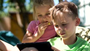 Video Stock Children Enjoying The Tablet In The Backyard Live Wallpaper For PC