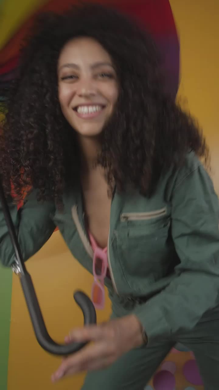 Download Video Stock Cheerful Girl Dancing With A Colorful Umbrella Live Wallpaper For PC