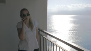 Video Stock Chatting On The Phone While Standing On A Balcony Live Wallpaper For PC
