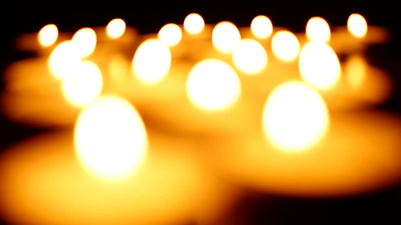 Download Video Stock Candles Lighting Up In The Dark Out Of Focus Live Wallpaper For PC