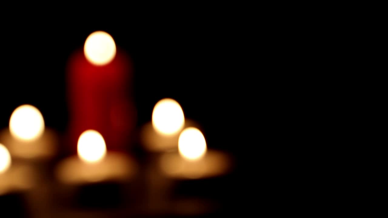 Download Video Stock Candles Burning In The Dark Out Of Focus Shot Live Wallpaper For PC