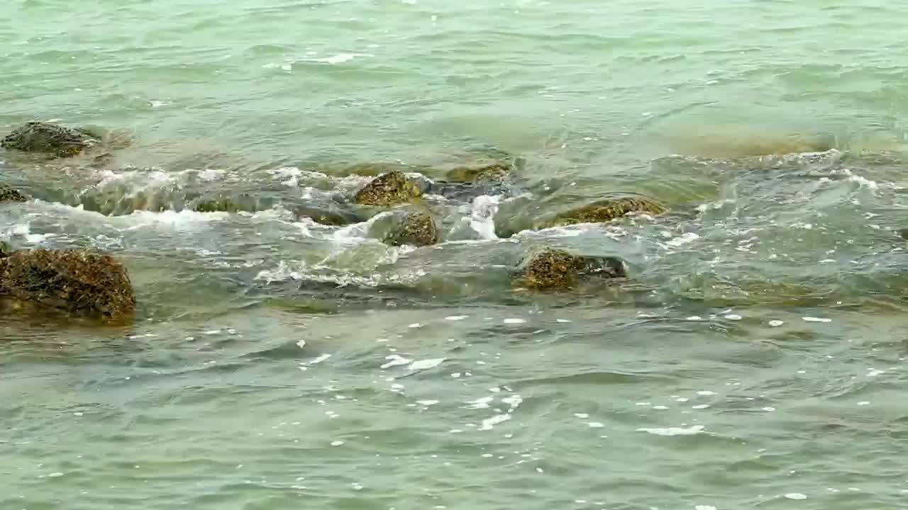 Download Video Stock Calm Waves Breaking Over Small Rocks Live Wallpaper For PC