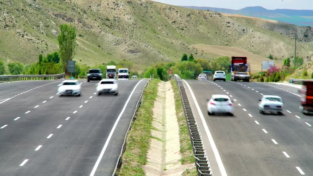 Download Video Stock Busy Highway Time Lapse With A Mountain In The Background Live Wallpaper For PC
