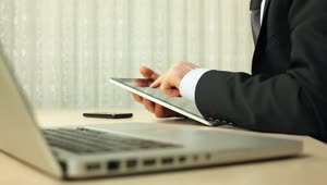Video Stock Businessman Working With A Tablet In His Desktop Live Wallpaper For PC