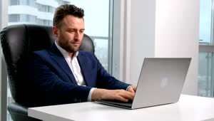 Video Stock Businessman Working On A Laptop At His Desktop Live Wallpaper For PC