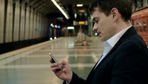 Video Stock Businessman Texting While Waiting In The Subway Live Wallpaper For PC