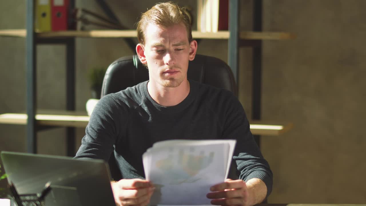 Download Video Stock Businessman Looks Over Finance Reports And Frowns Live Wallpaper For PC