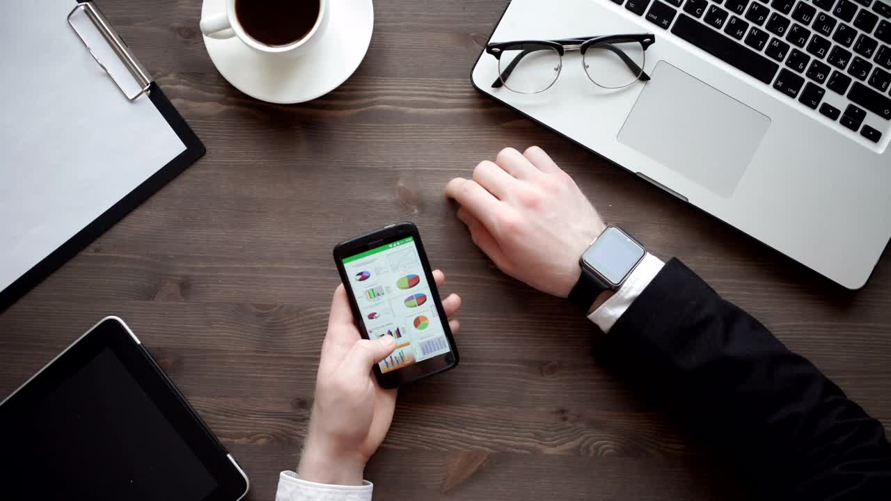 Download Video Stock Businessman Checking Data On His Mobile Phone Live Wallpaper For PC