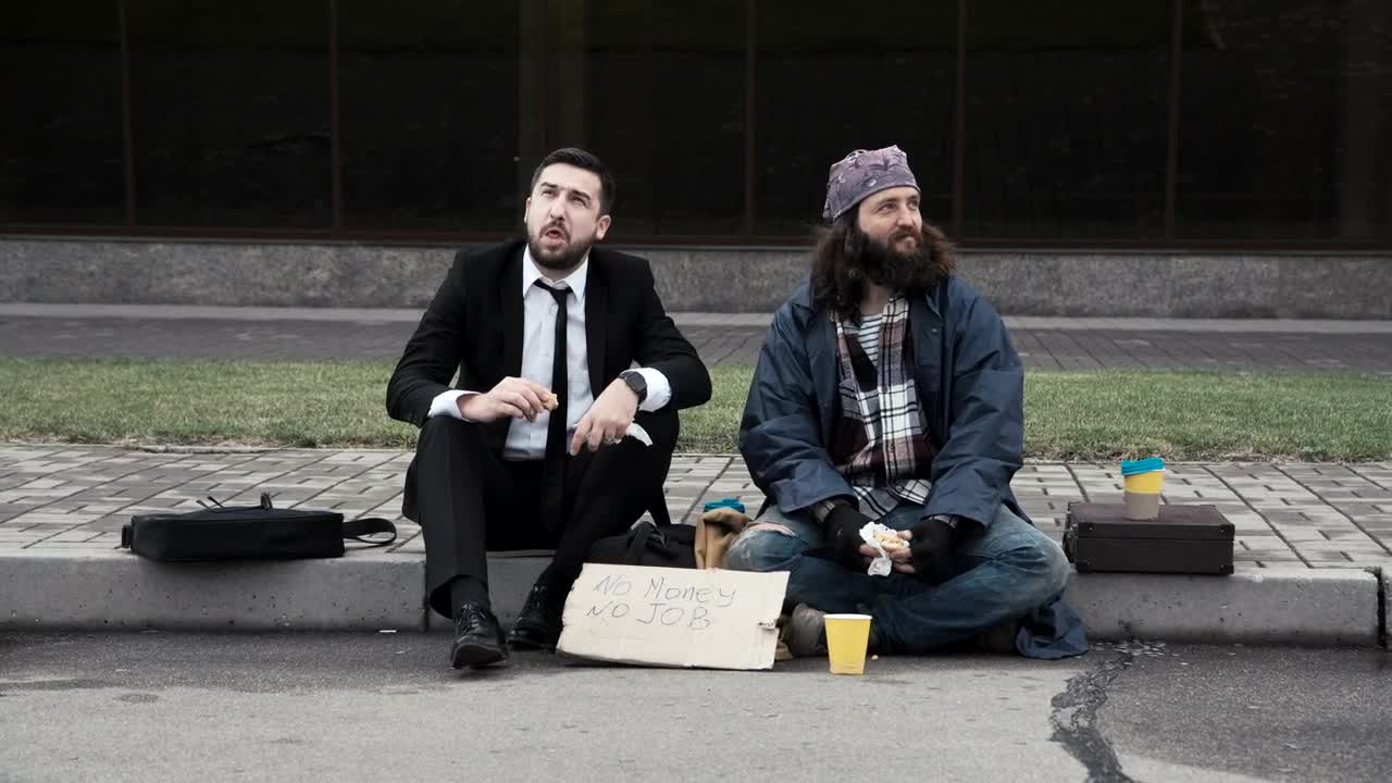 Download Video Stock Businessman And Homeless Sitting On The Sidewalk Live Wallpaper For PC