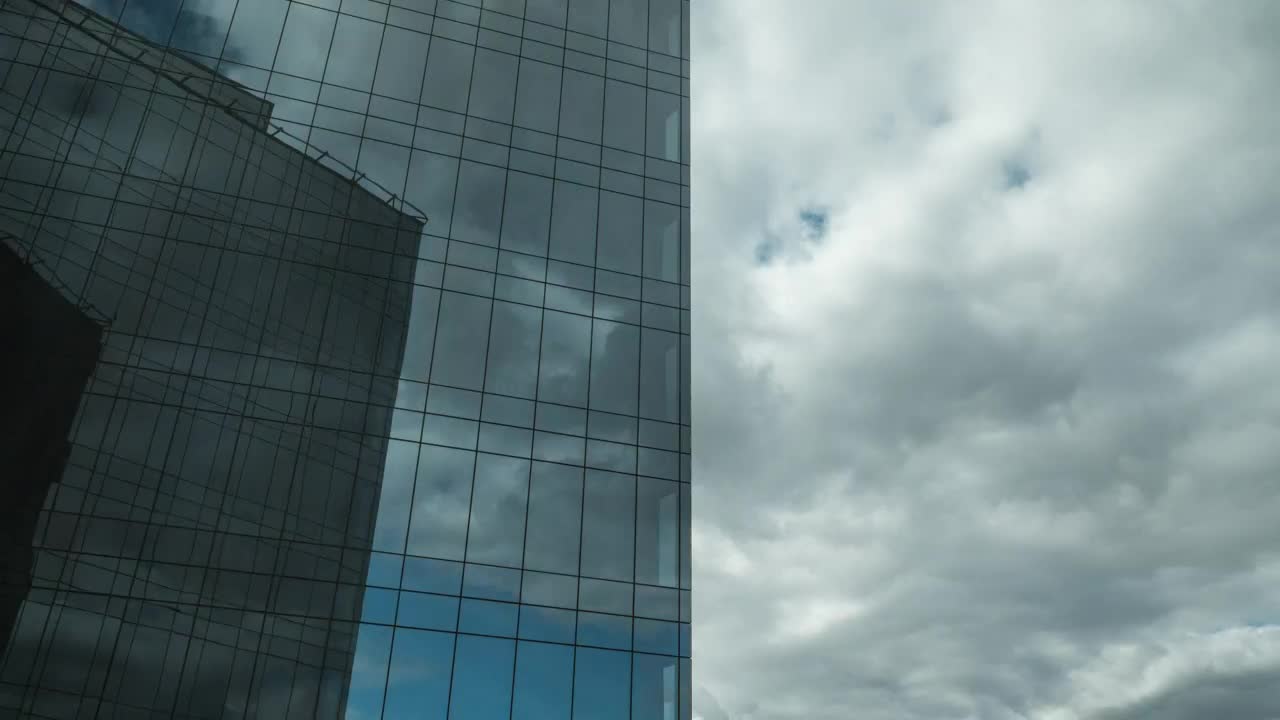 Download Video Stock Clouds Moving Above A Glass Skyscraper Live Wallpaper For PC