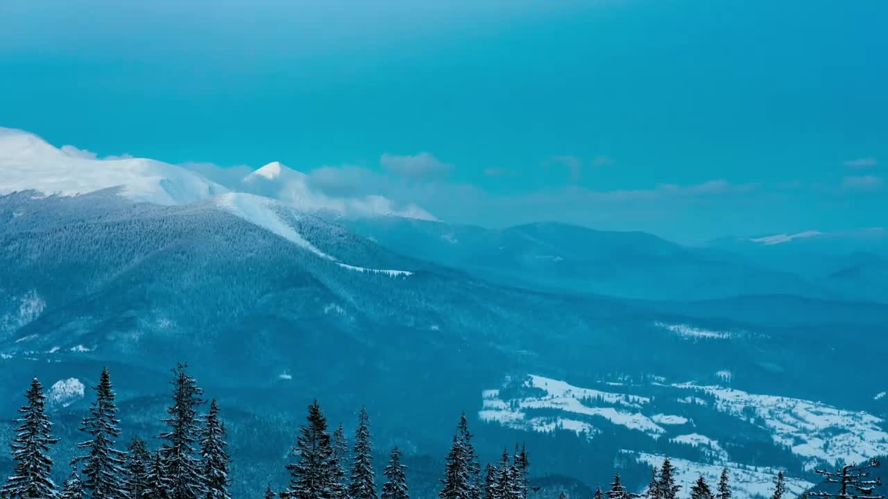 Download Video Stock Clouds Forming Over The Snowy Mountains Live Wallpaper For PC