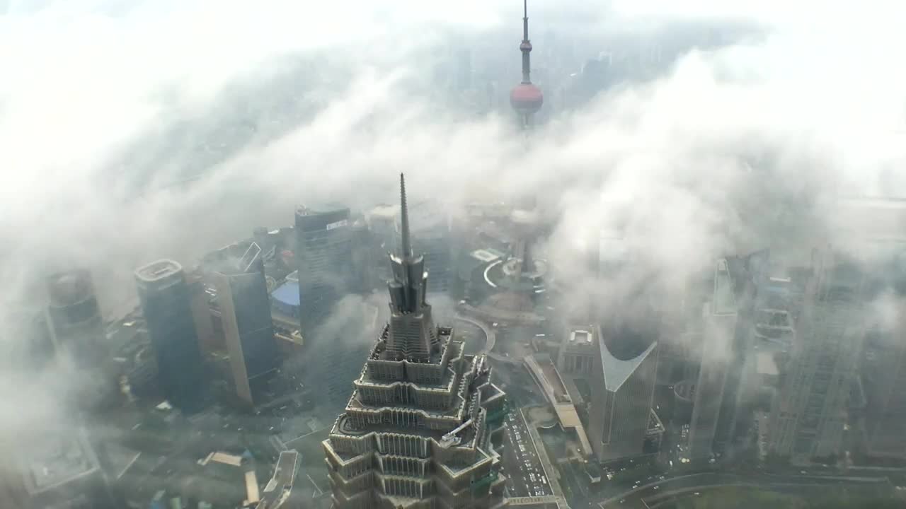 Download Video Stock Clouds Covering A Skyscraper In Shanghai Live Wallpaper For PC