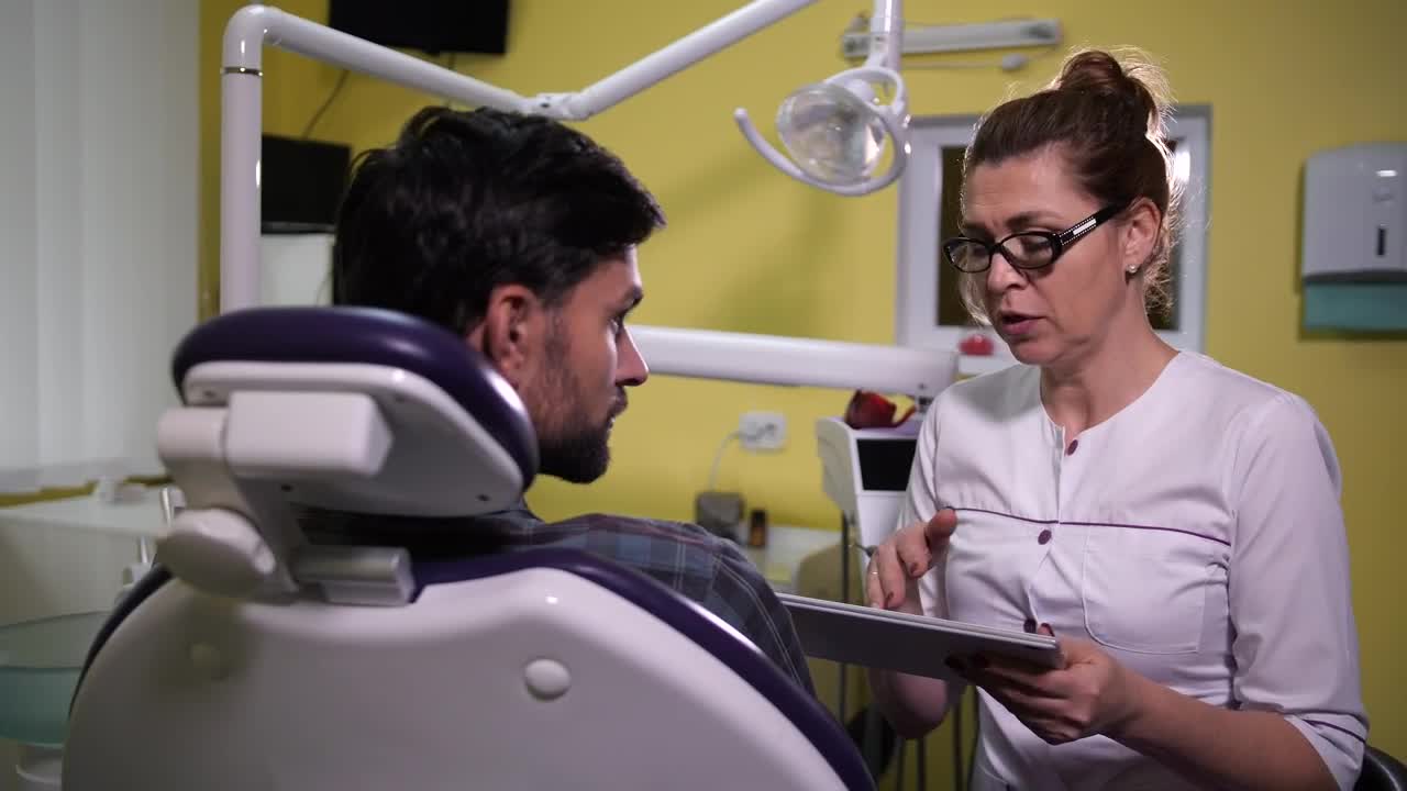 Download Stock Video Dentist Using A Tablet While Speaking Live Wallpaper For PC