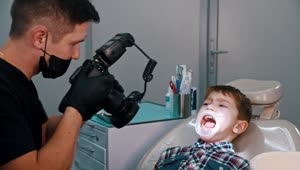 Stock Video Dentist Taking Photos Of A Little Boys Teeth Live Wallpaper For PC