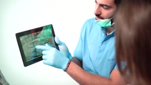 Stock Video Dentist Shows Patient Teeth On X Ray Live Wallpaper For PC
