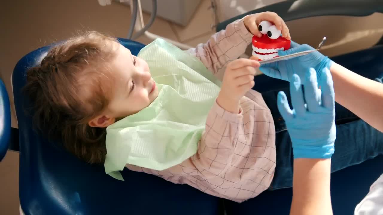 Download Stock Video Dentist Playing With A Little Patient With A Toy Live Wallpaper For PC