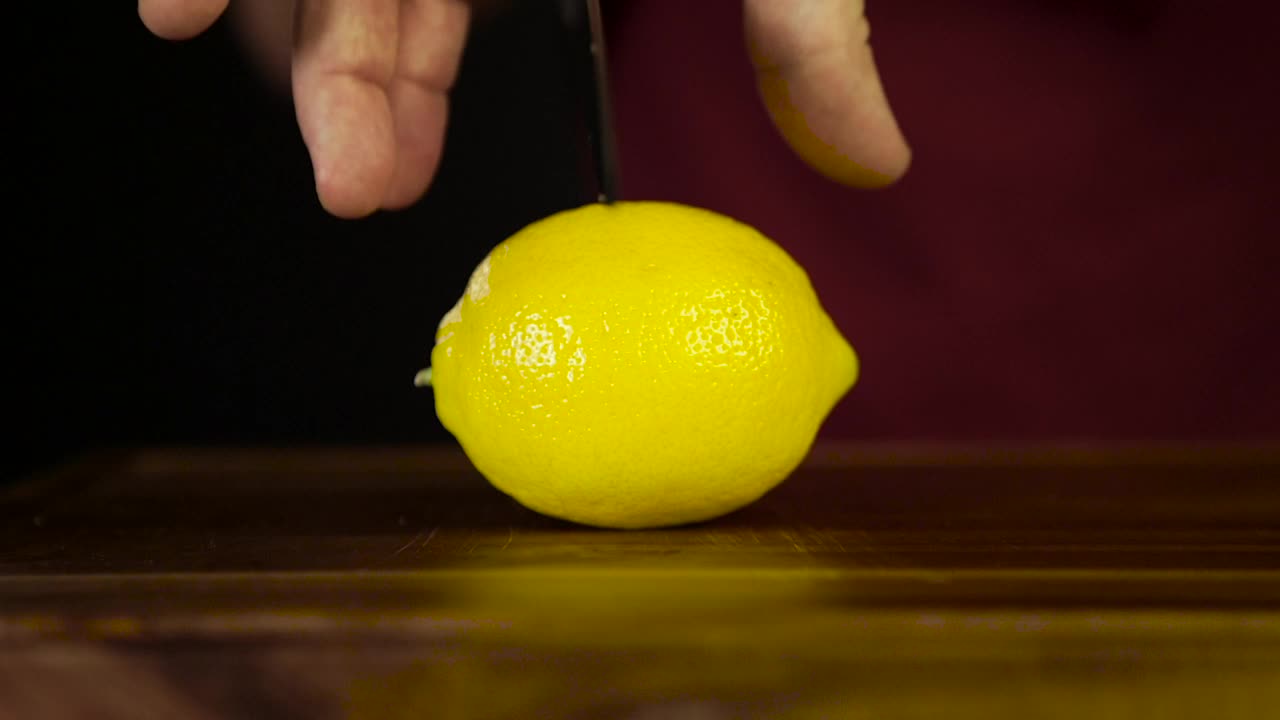 Download Stock Video Cutting Through A Lemon With A Knife Live Wallpaper For PC