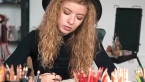 Stock Video Creative Girl Sketches On Desk In Art Studio Live Wallpaper For PC