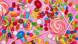 Stock Video Covering A Pink Background With Candies In Stop Motion Live Wallpaper For PC