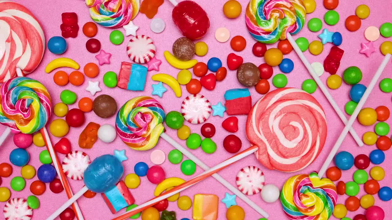 Download Stock Video Covering A Pink Background With Candies In Stop Motion Live Wallpaper For PC