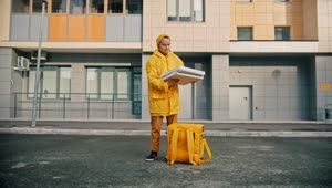 Stock Video Courier Man With Yellow Uniform Opens A Pizza Box Live Wallpaper For PC
