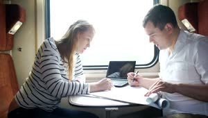 Stock Video Couple Working During A Train Journey Live Wallpaper For PC