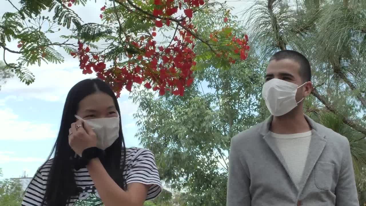 Download Stock Video Couple With Masks Walking In A Park Live Wallpaper For PC