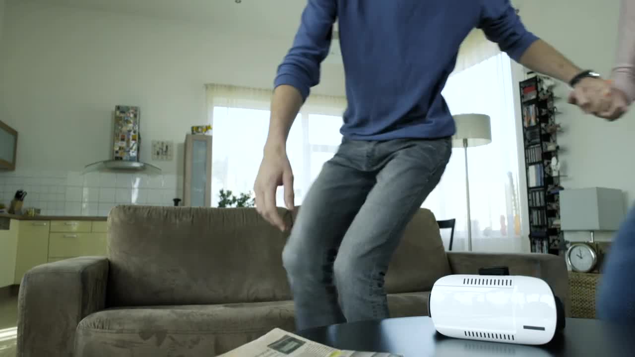 Download Stock Video Couple Trying Vr Glasses On The Living Room Live Wallpaper For PC