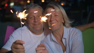 Stock Video Couple Smiling With Sparklers Live Wallpaper For PC