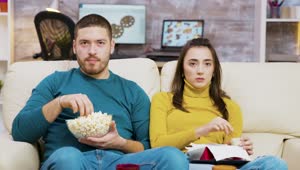 Stock Video Couple Shows Fear While Watching Movie On Sofa Live Wallpaper For PC